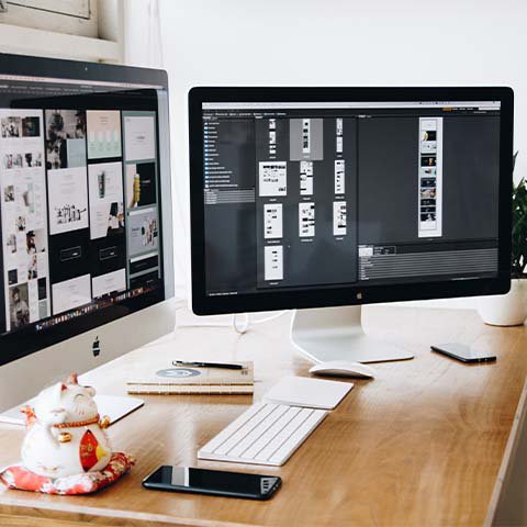picture of a computer with two monitors and desk